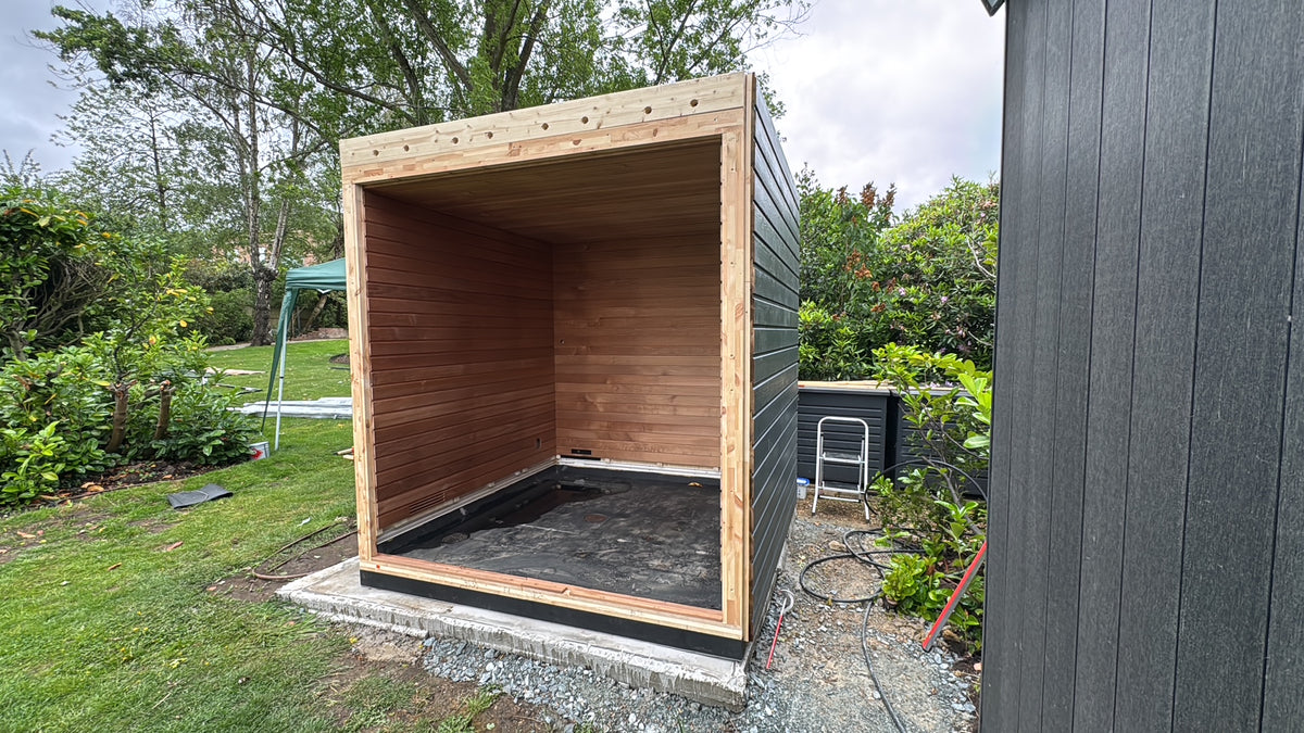 Sauna enclosure with roof and external cladding in place