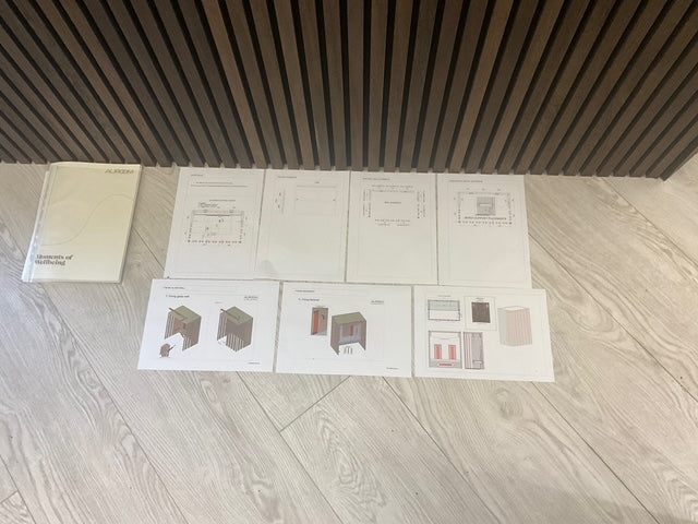 Sauna drawings and installation plans laid out on site