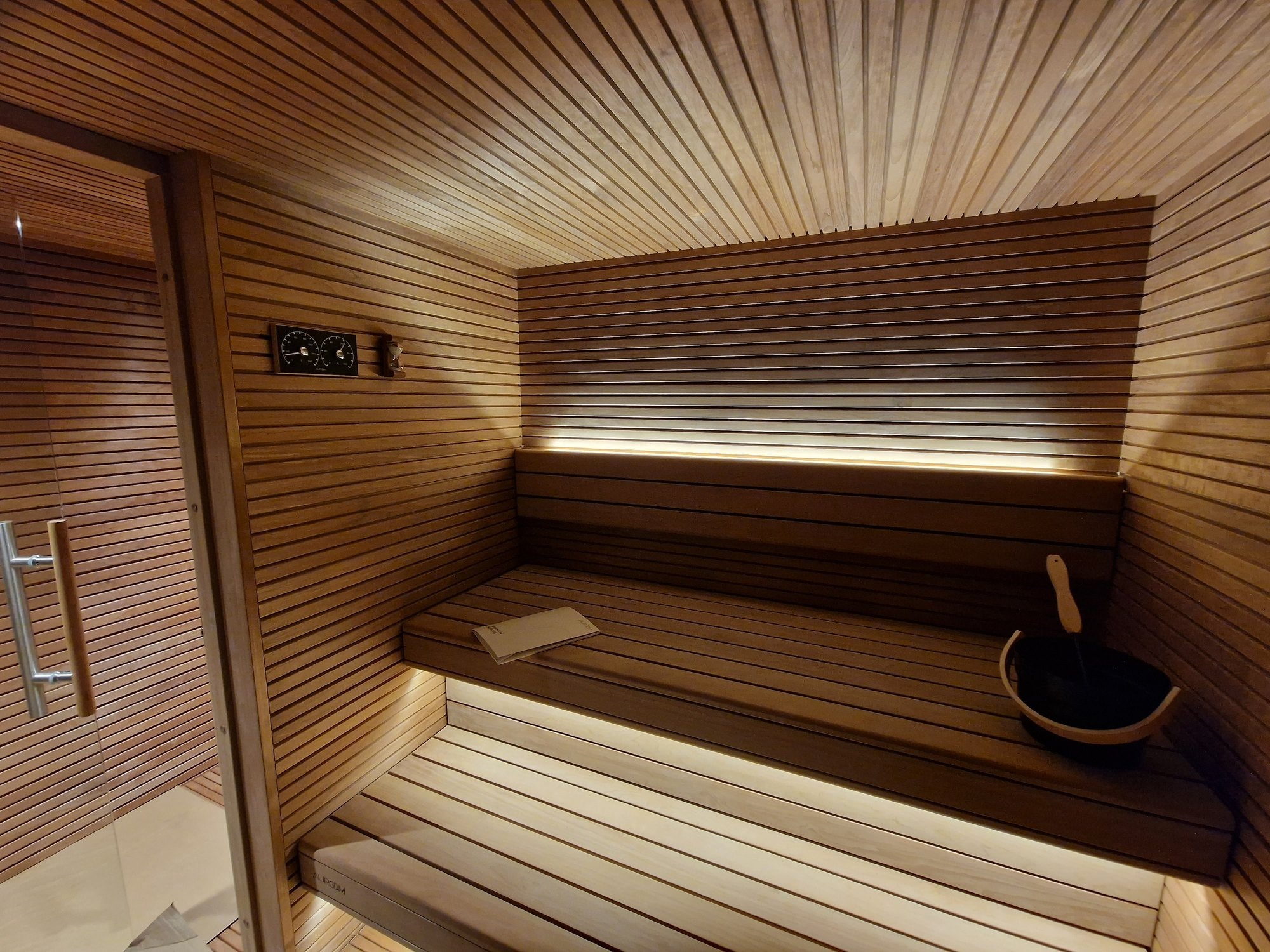 Timber sauna benches and concealed lighting