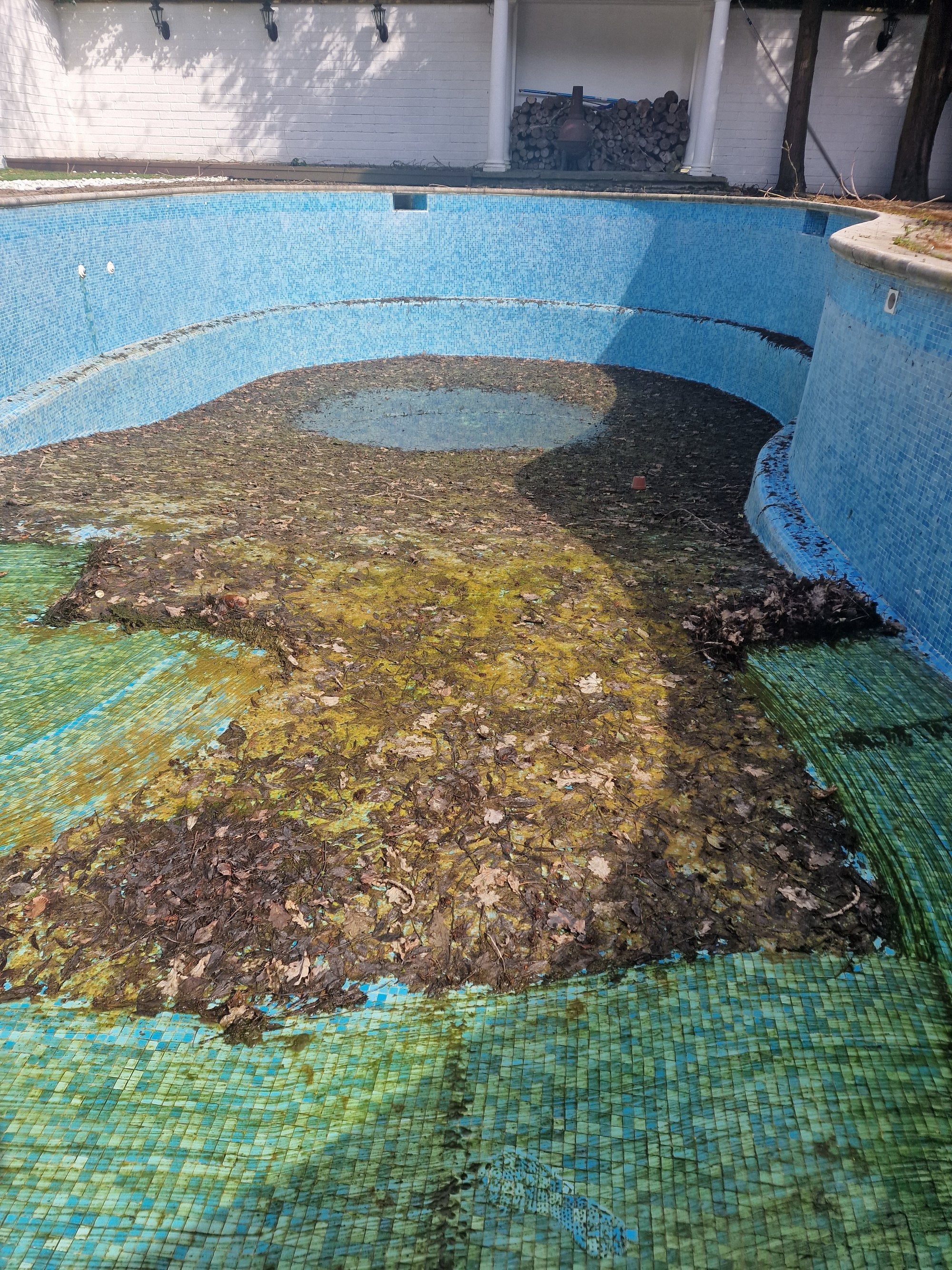 Outdoor swimming pool before cleaning and restoration