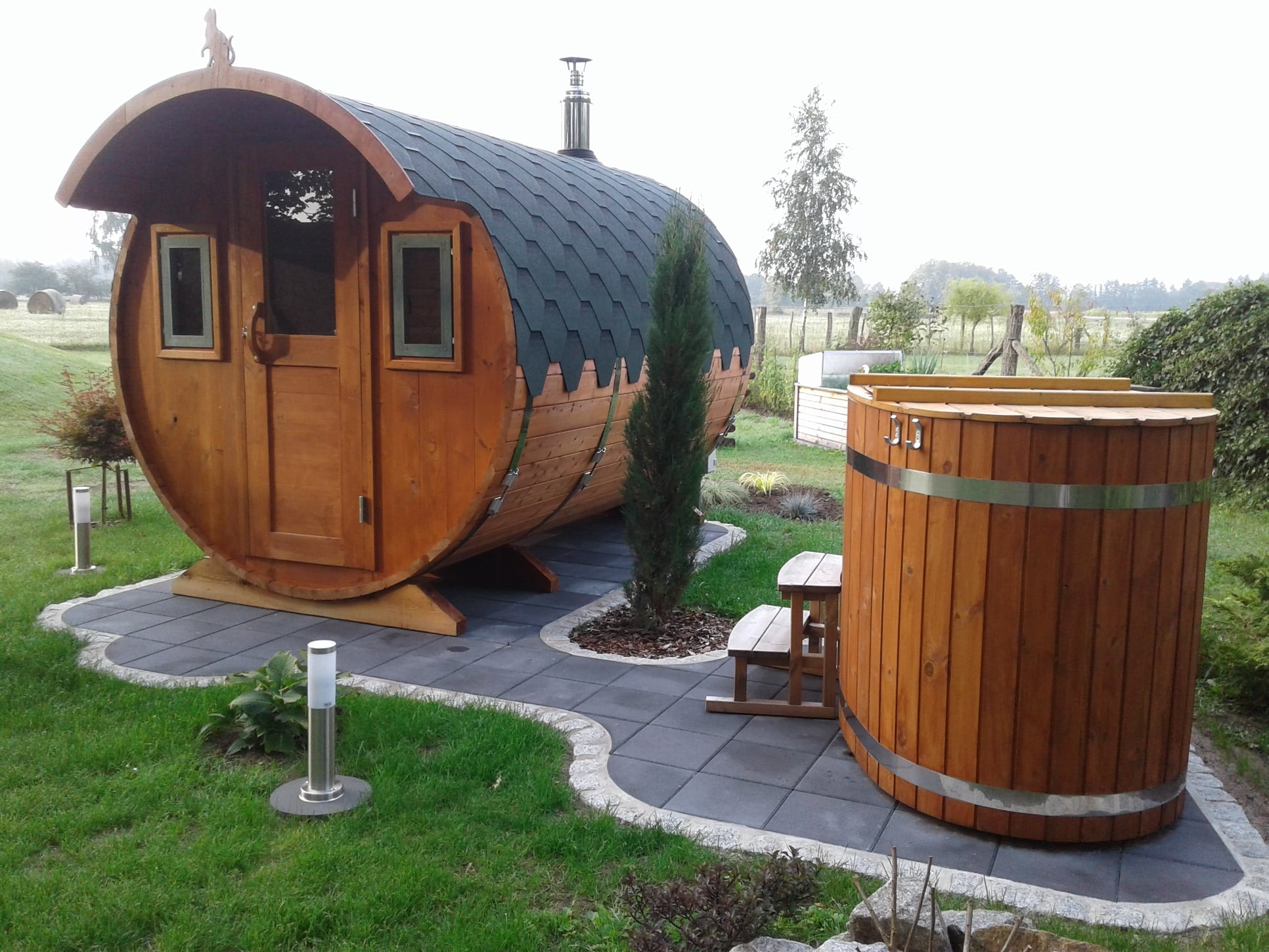 Wooden sauna and hot tub in the countryside
